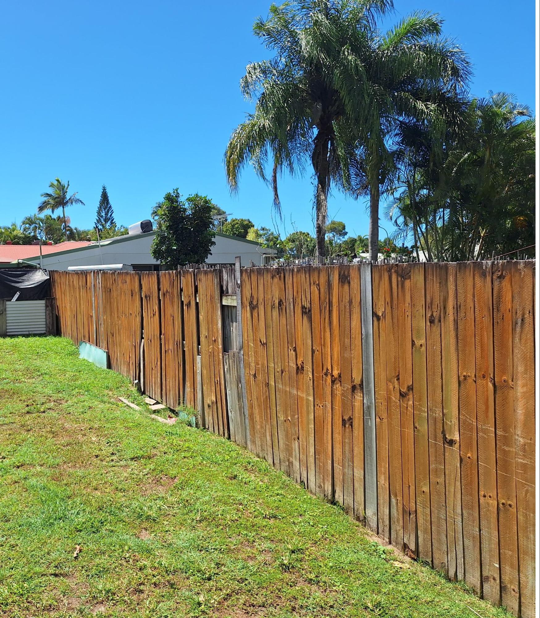 timber fence that needs replacing